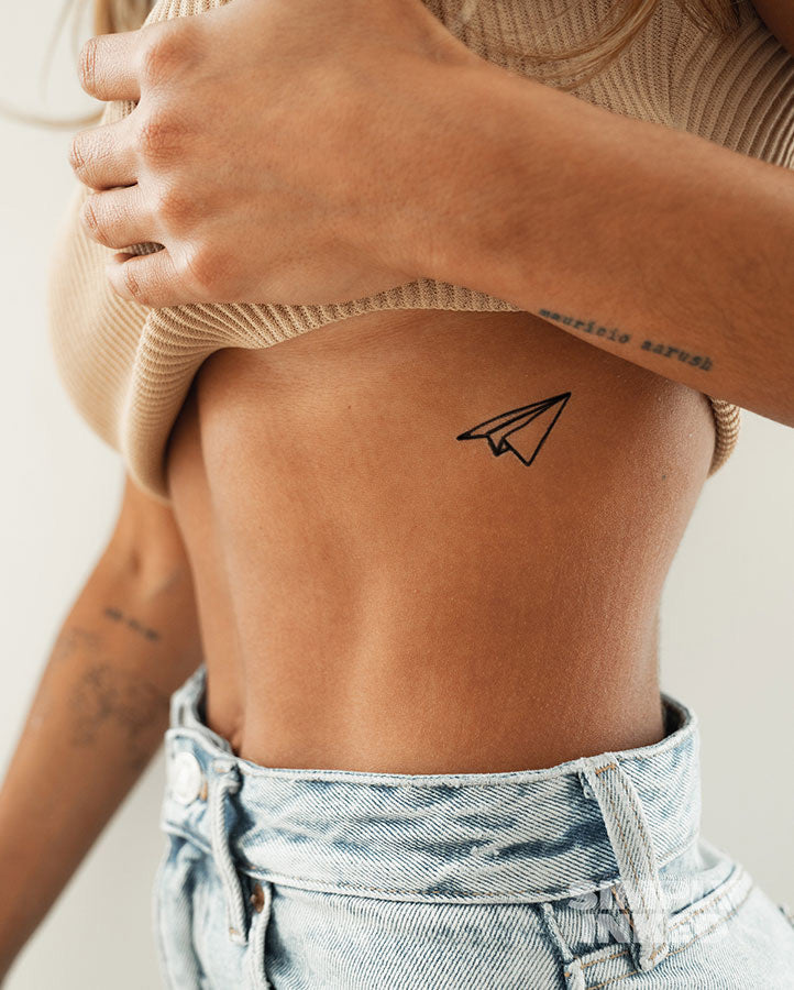 I got a titchy fine line airplane tattoo done on my boob - a year on it  looks nothing like it did | The Irish Sun